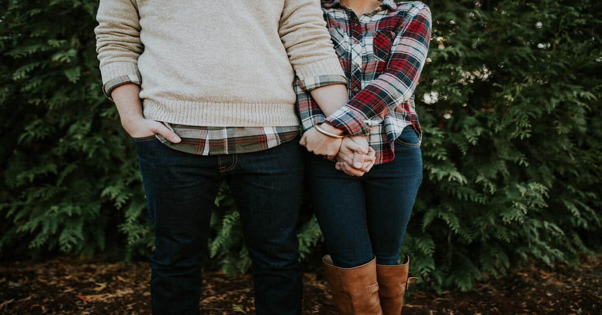 Couple holding hands.