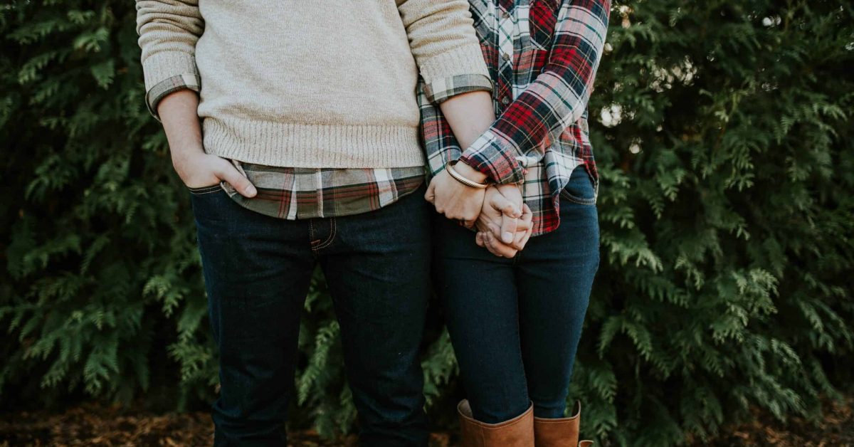 Couple holding hands.