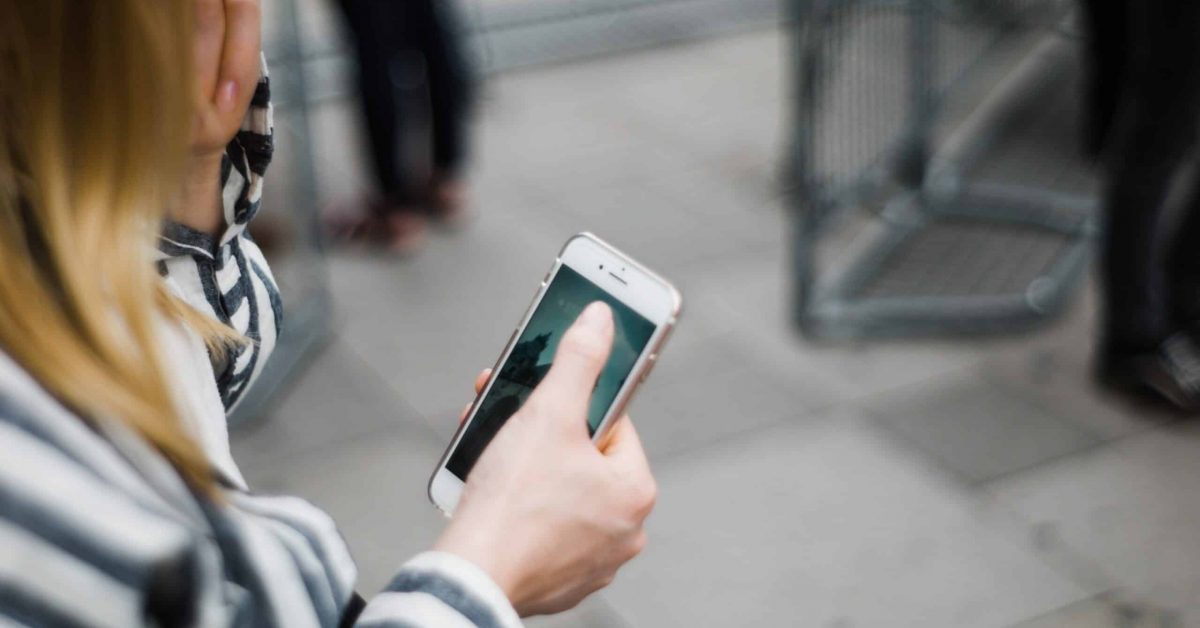 A woman with a smartphone.