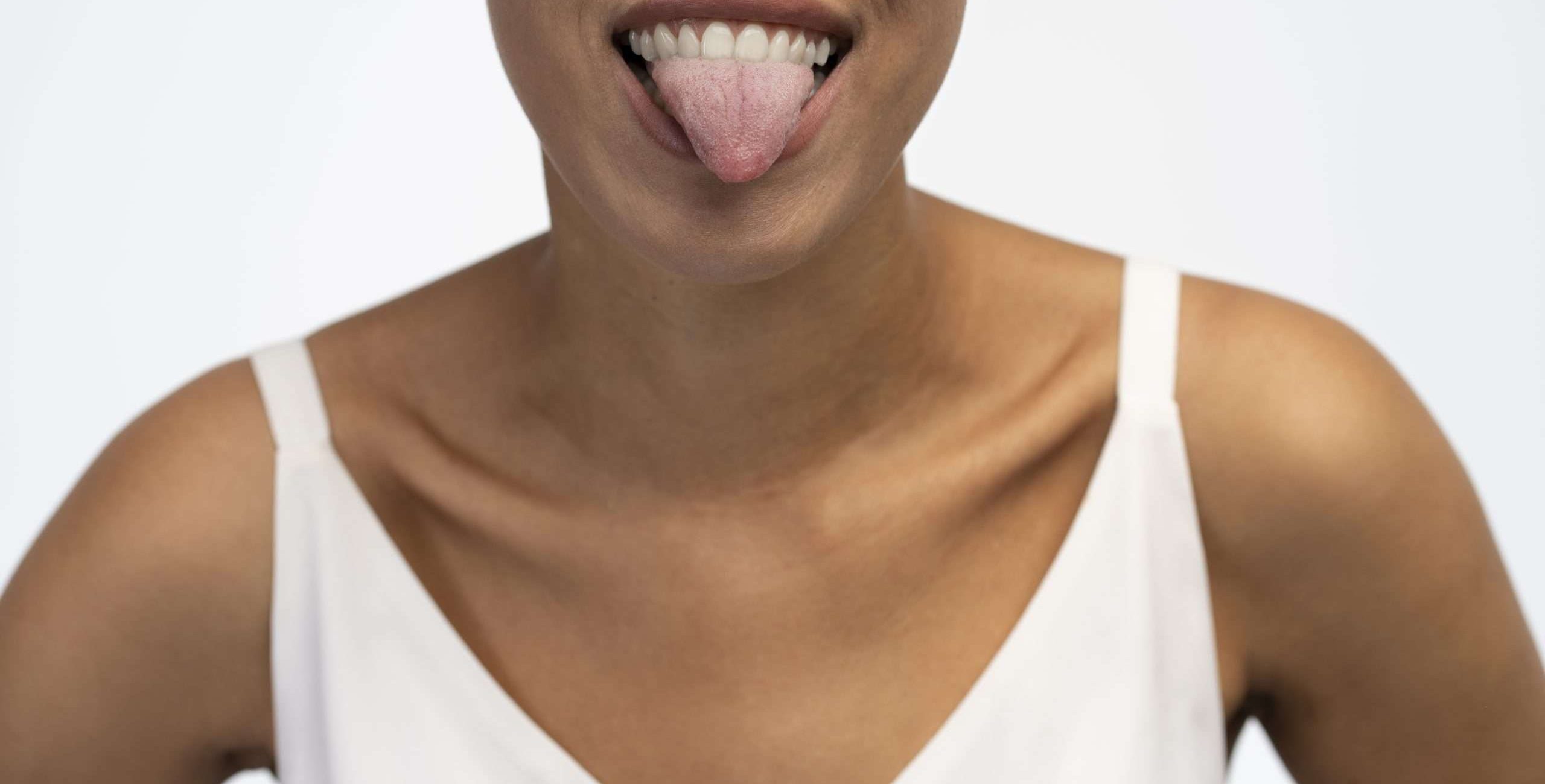 Person sticking their tongue out of their mouth