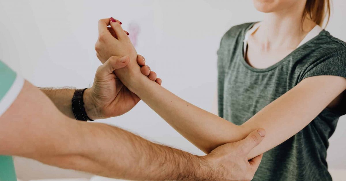 An individual receives a medical inspection og their arm.