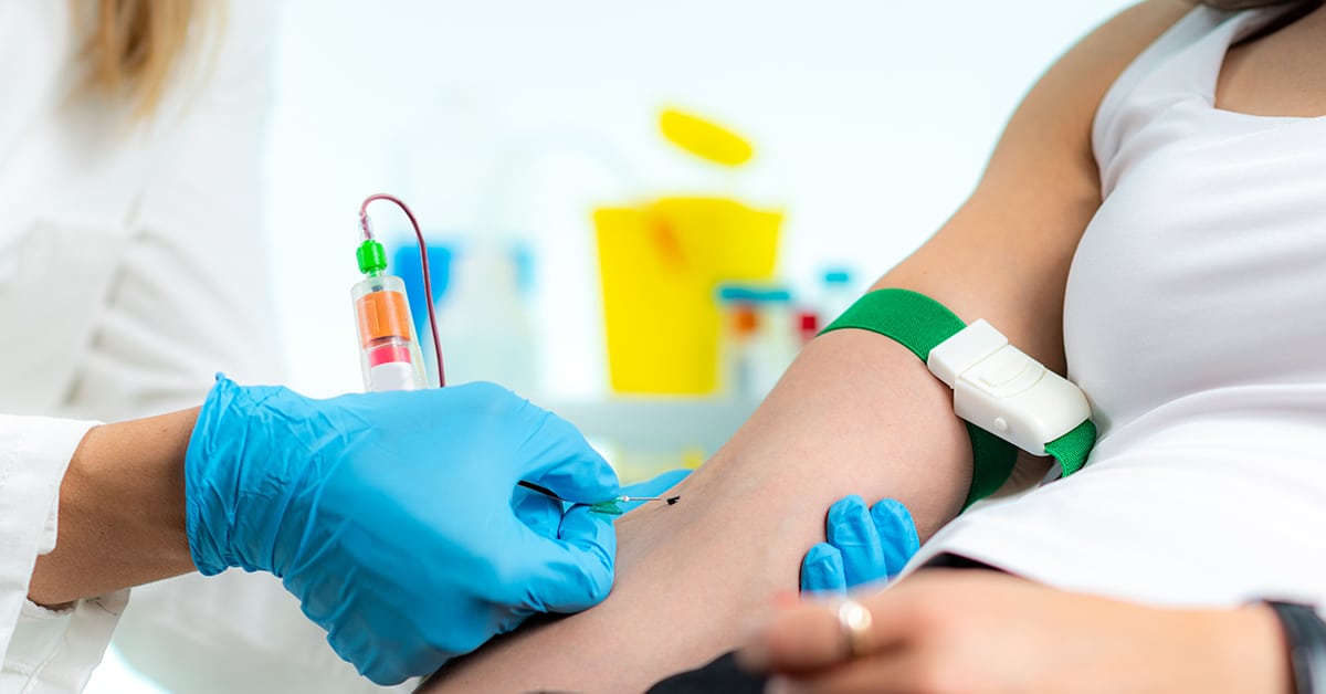 Phlebotomy procedure during coronavirus crisis. medical worker preparing to take blood for analysis